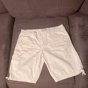 White shorts with 4 pockets on the front.